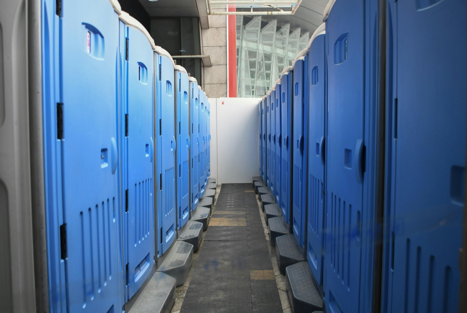 A serviced bank of portable restrooms on a Sacramento job site